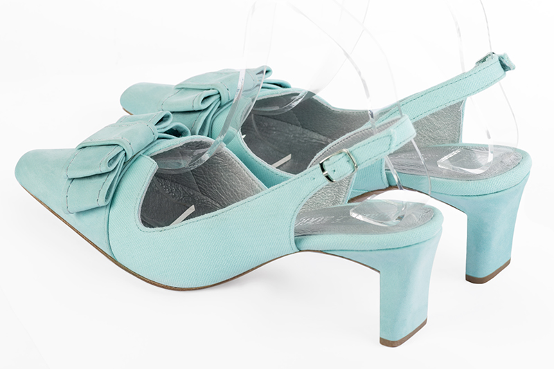 Aquamarine blue women's open back shoes, with a knot. Tapered toe. Medium comma heels. Rear view - Florence KOOIJMAN